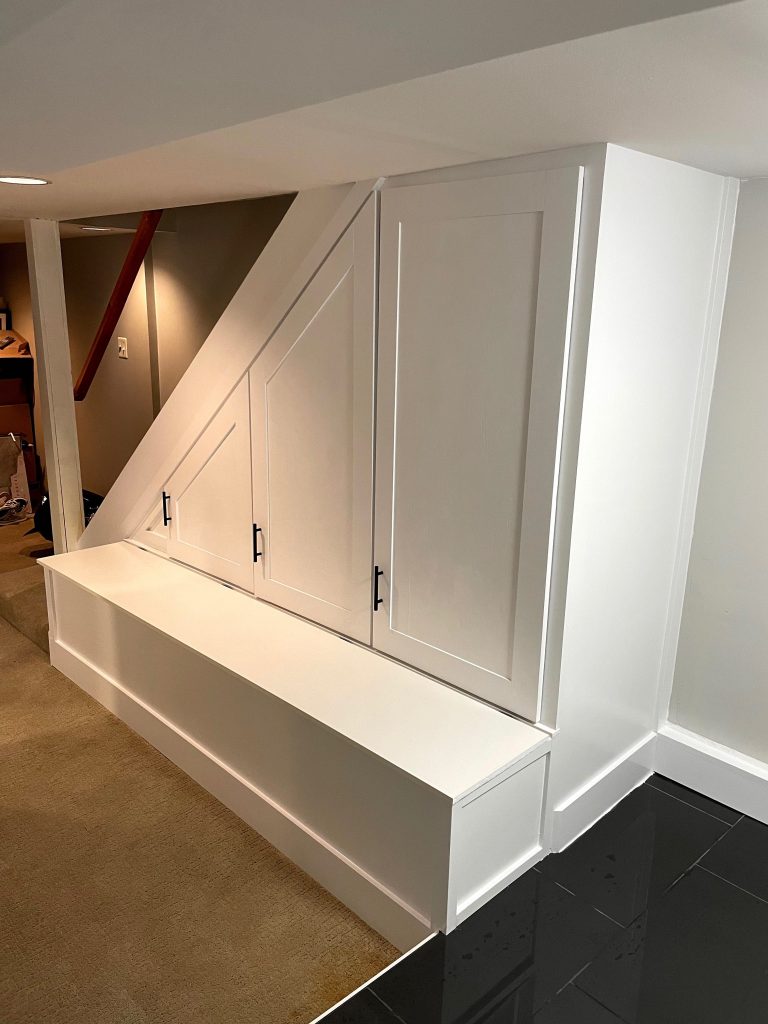 Toronto custom built in carpentry under stair storage closet
