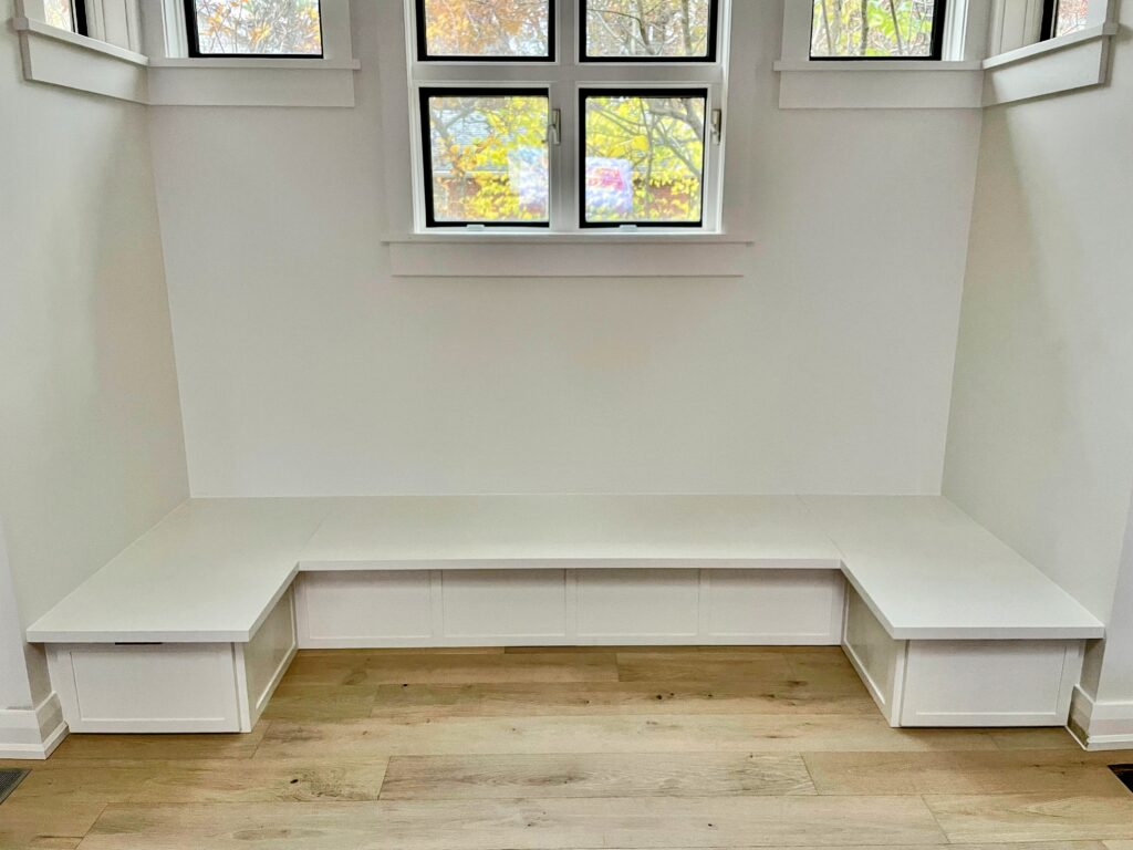 Custom built in banquette seating storage bench with drawers